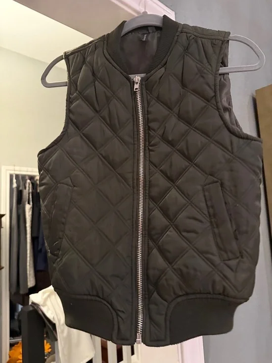 The Story Quilted Zipper Front Puffer Vest in Olive - Picture 1 of 4